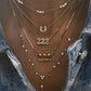 14kt gold single row diamond bezel drip lariat necklace