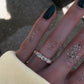 14kt gold five horizontal emerald cut diamond bezel band