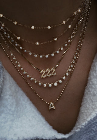 14kt gold graduated diamond bezel necklace