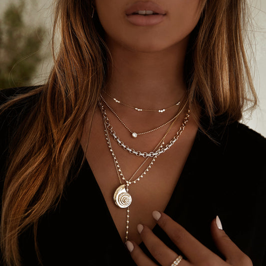 14kt gold diamond spiral shell necklace