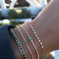 14kt gold emerald cut emerald bezel tennis bracelet