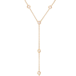 14kt gold single row diamond bezel lariat