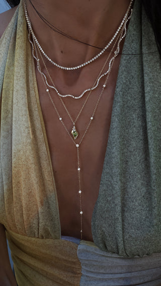 14kt gold single row diamond bezel lariat