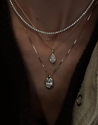 14kt gold teardrop diamond side halo bezel necklace