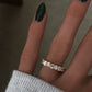 14kt gold mixed oval emerald diamond half eternity band
