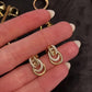 14kt gold and diamond knot stud
