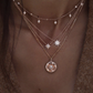 14kt gold and gray diamond starburst hammered disk necklace