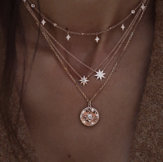 14kt gold and gray diamond starburst hammered disk necklace