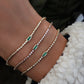 14kt gold and diamond bezel emerald baguette bracelet