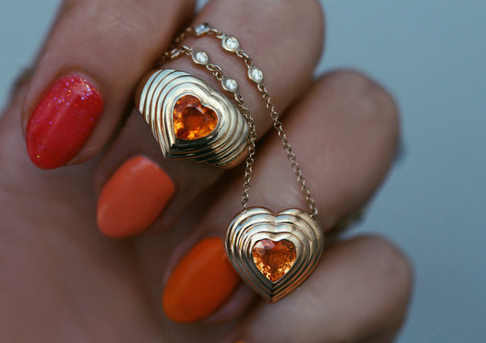 14kt gold and diamond heart burst orange sapphire necklace
