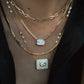 14kt gold full diamond bezel emerald cut necklace