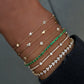 14kt gold emerald tennis bracelet