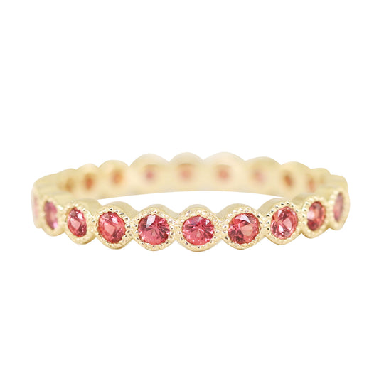 14kt gold fire orange sapphire bezel eternity ring